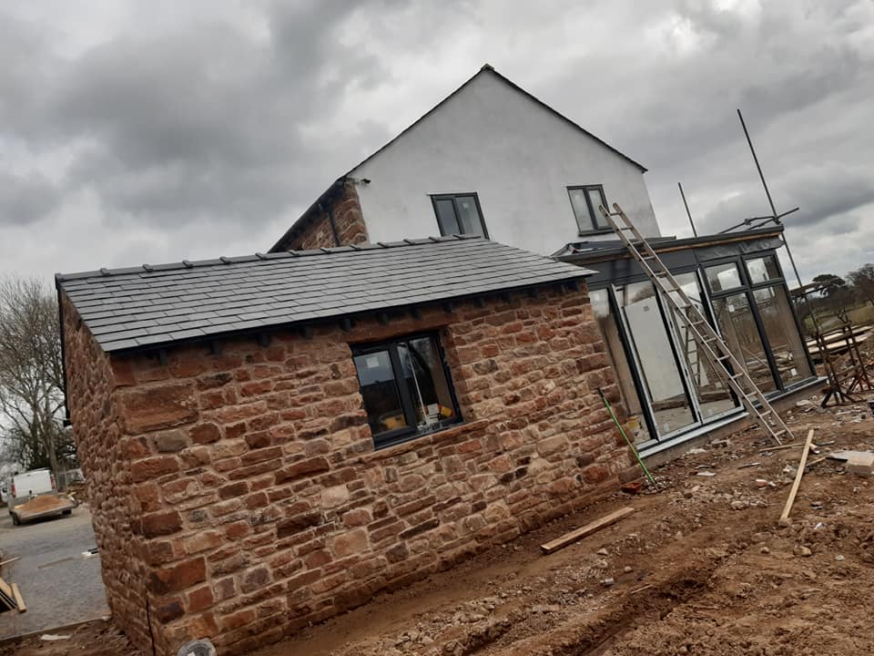 Stone cottage with new slate roof and conservatory